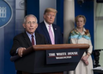 As COVID-19 patient Trump rips off mask, Fauci urges Americans to put it on