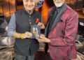 Anupam Kher gifts his latest book to Amitabh Bachchan