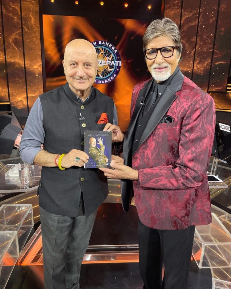 Anupam Kher gifts his latest book to Amitabh Bachchan