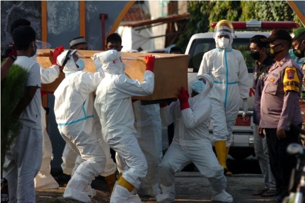 Indonesia eases COVID-19 curbs as cases drop from peak