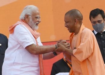 Modi greets CM Yogi Adityanath, UP ministers on taking oath
