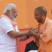 Modi greets CM Yogi Adityanath, UP ministers on taking oath