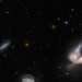 Hubble captures unusual galaxy merger in ancient universe