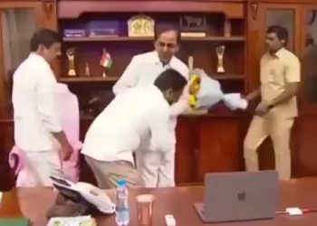 Telangana official triggers row by touching CM’s feet