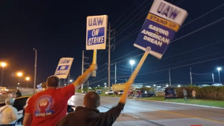 Over 13,000 workers at three US auto plants strike work that could hit US economy