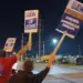 Over 13,000 workers at three US auto plants strike work that could hit US economy