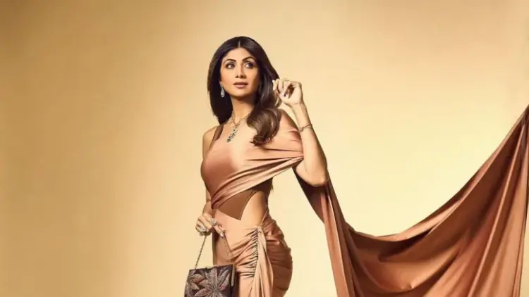 Sizzling Shilpa ‘knocks’ over fans with sari gown photoshoot