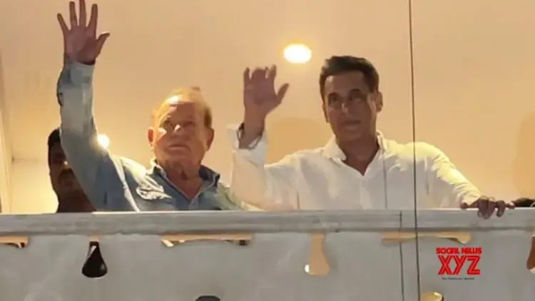 Salman, joined by father Salim Khan, greets cheering crowds outside Galaxy Apts